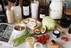 A variety of fresh ingredients and kitchen tools for preparing a healthy meal.
